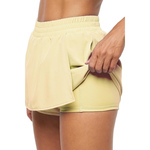 image:imageMarika Womens Lillian Asymmetrical Wrap Active SkortWax Yellow